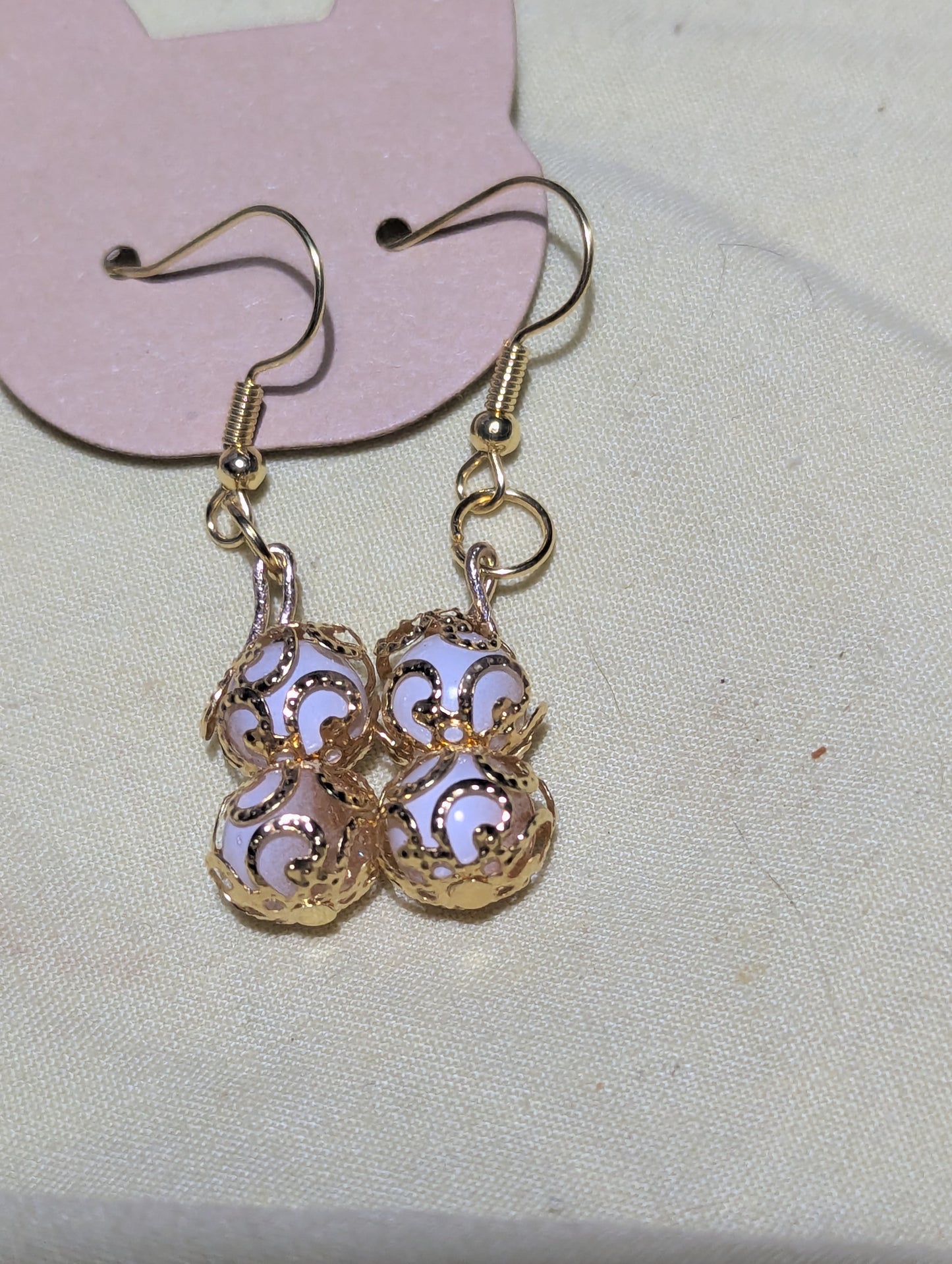 Pendientes de doble caída en tonos blanco y dorado